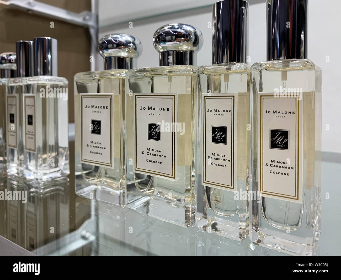 Jo Malone perfumes on display on a shop. Jo Malone London is a British perfume and scented candle brand, founded by Jo Malone in 1983. Rare niche Stock Photo