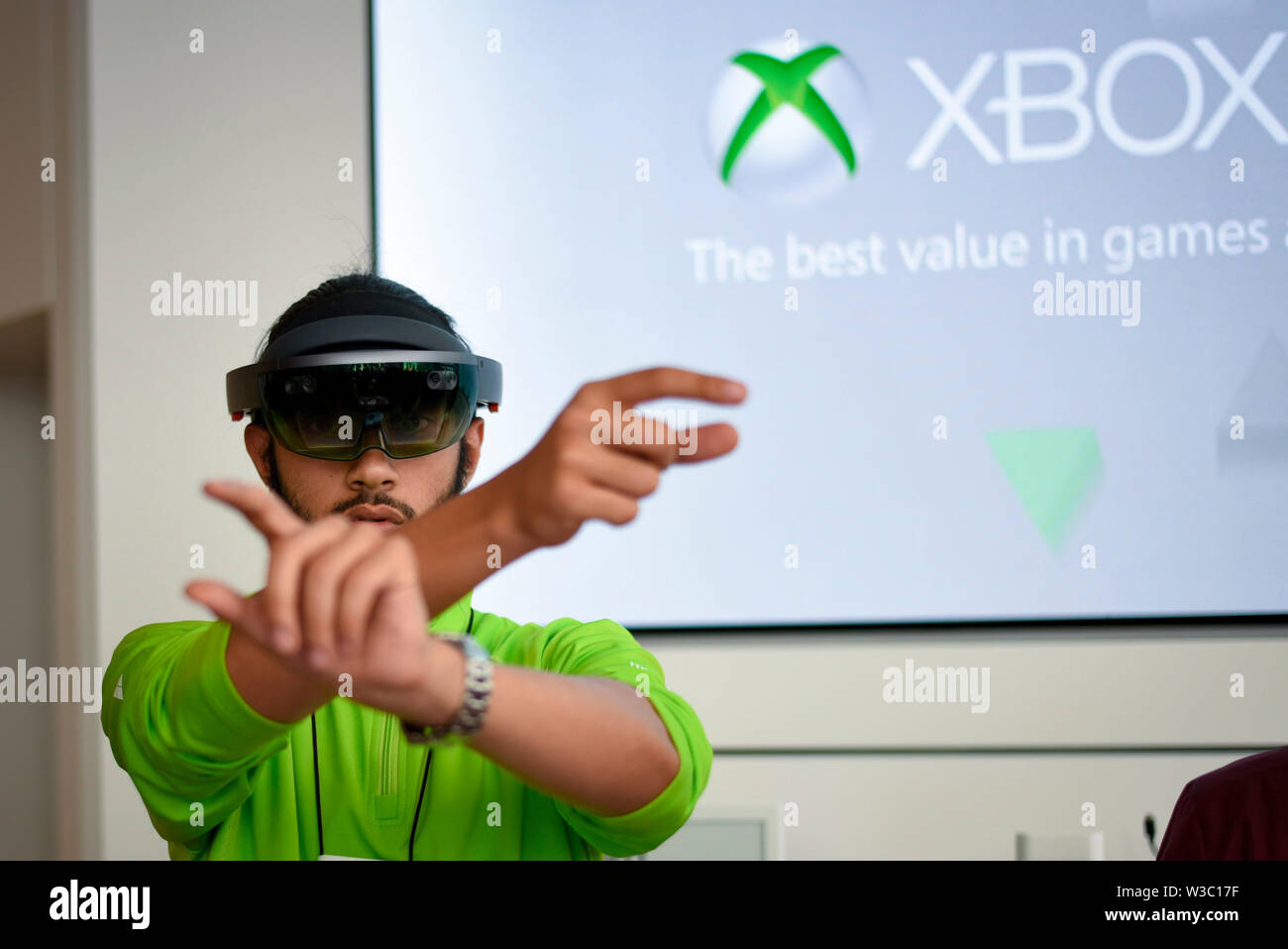 London, UK.  14 July 2019.  A staff member demonstrates a Microsoft Hololens at the new Microsoft store at Oxford Circus, the company's first physical retail store in the UK. Credit: Stephen Chung / Alamy Live News Stock Photo