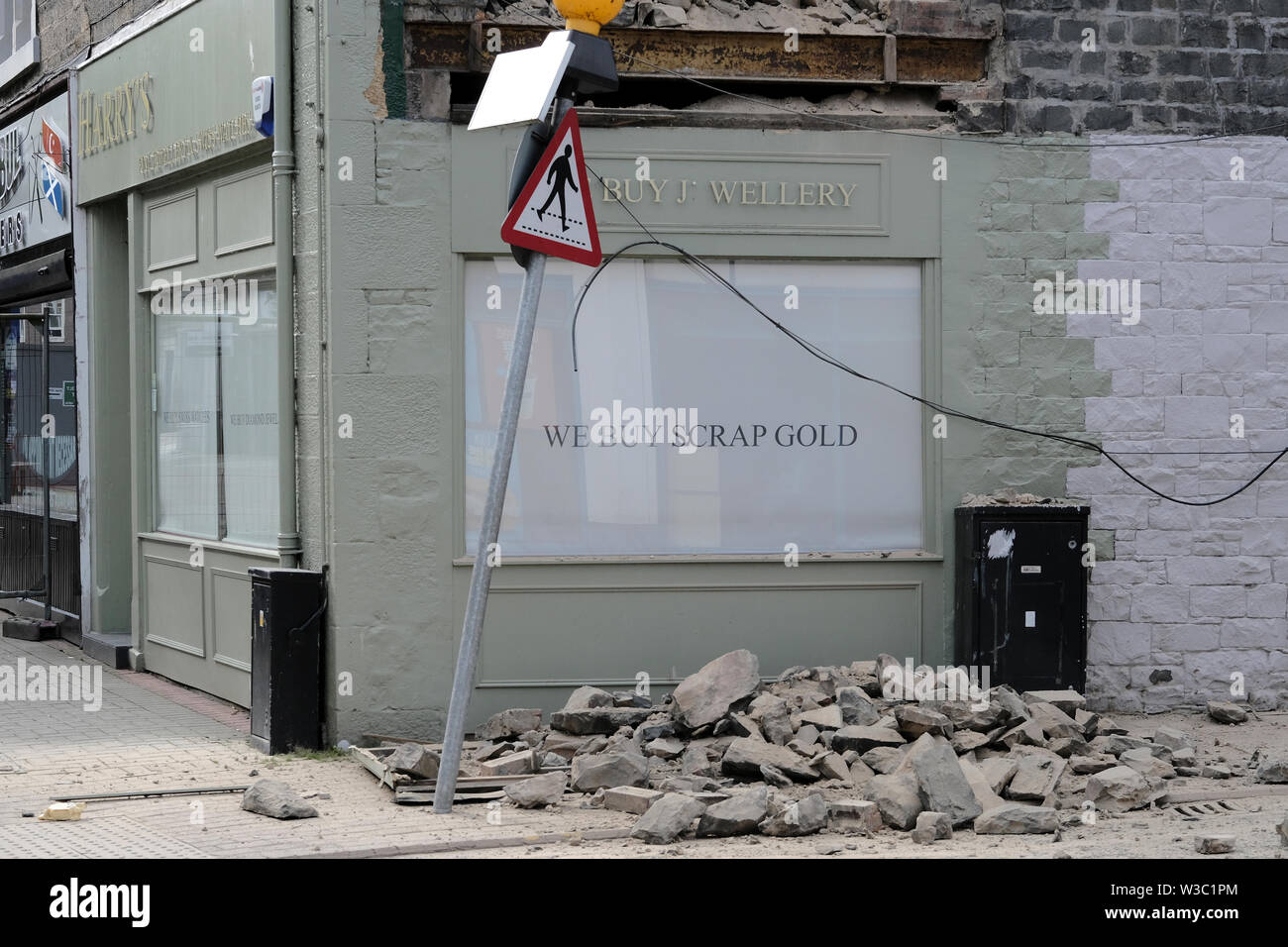 Galashiels, Scotland, UK. 14th July 2019.     Building Collapse, Galashiels The scene in Galashiels after part of an upper floor house exterior wall collapsed. A street in Galashiels town centre is currently closed after part of a building collapsed. The incident happened in Park Street this morning (Sunday). No one was injured.  Credit: Rob Gray/Alamy Live News Stock Photo