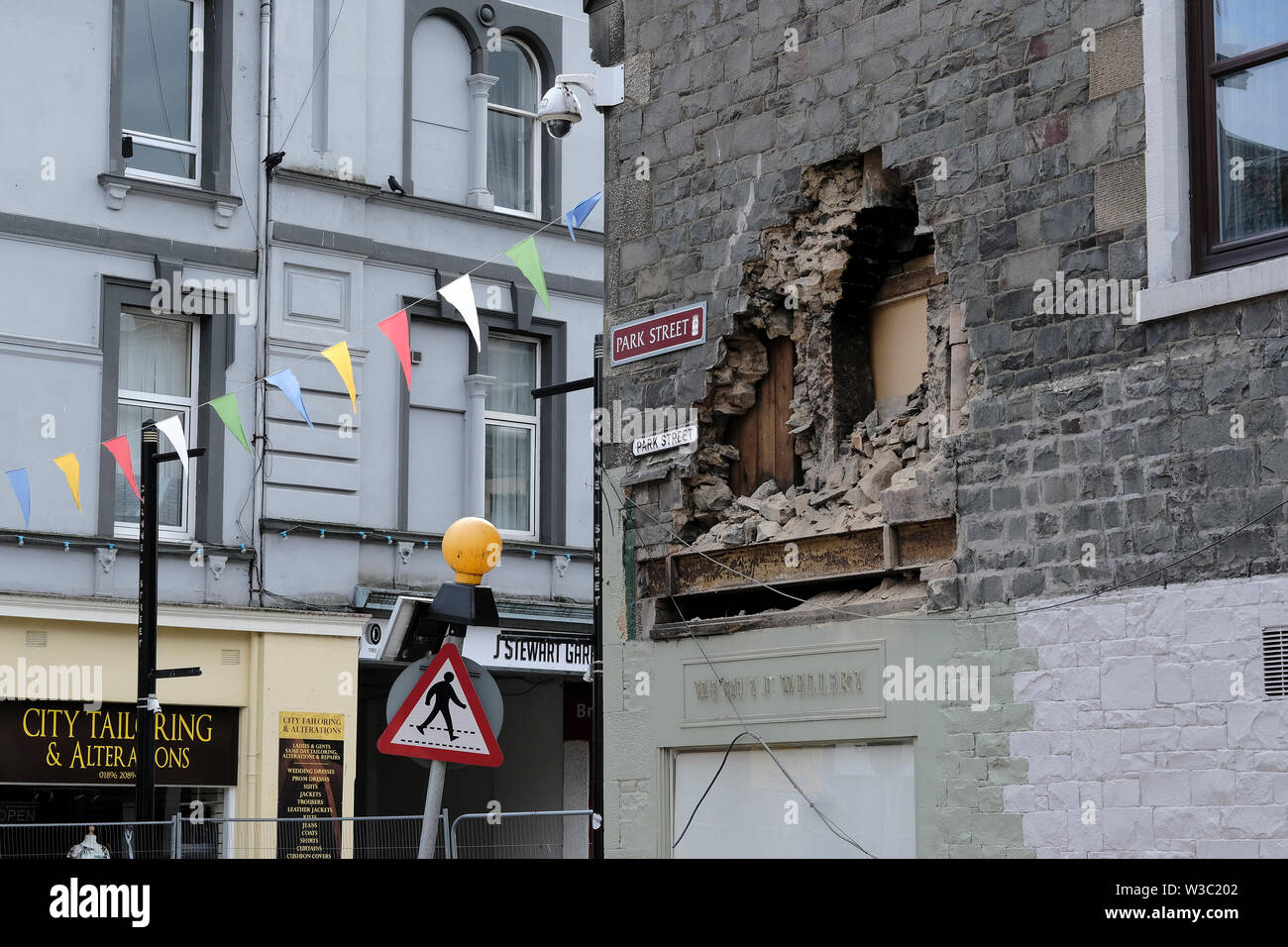 Galashiels, Scotland, UK. 14th July 2019.     Building Collapse, Galashiels The scene in Galashiels after part of an upper floor house exterior wall collapsed. A street in Galashiels town centre is currently closed after part of a building collapsed. The incident happened in Park Street this morning (Sunday). No one was injured.  Credit: Rob Gray/Alamy Live News Stock Photo