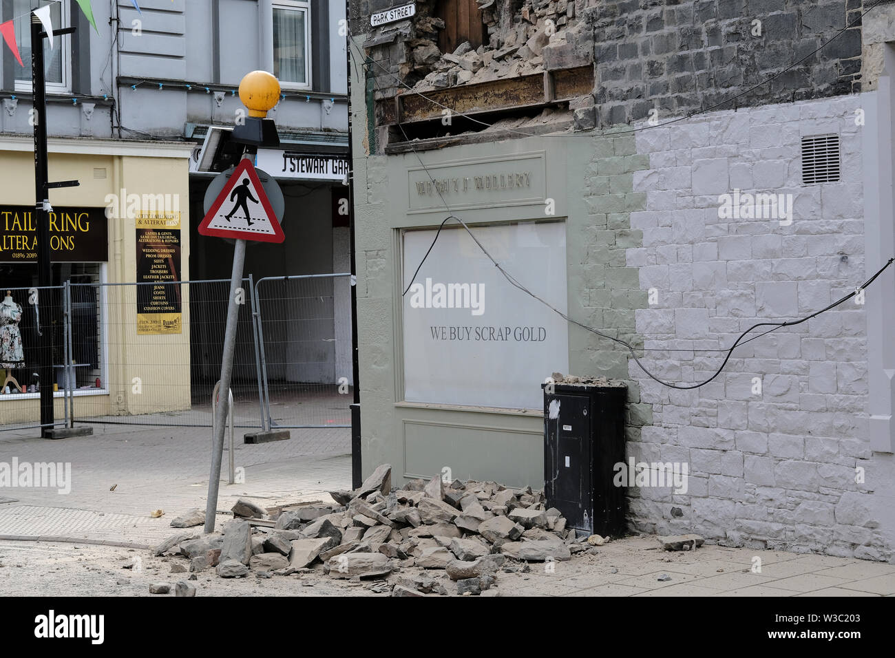 Galashiels, Scotland, UK. 14th July 2019.     Building Collapse, Galashiels The scene in Galashiels after part of an upper floor house exterior wall collapsed. A street in Galashiels town centre is currently closed after part of a building collapsed. The incident happened in Park Street this morning (Sunday). No one was injured.  Credit: Rob Gray/Alamy Live News Stock Photo