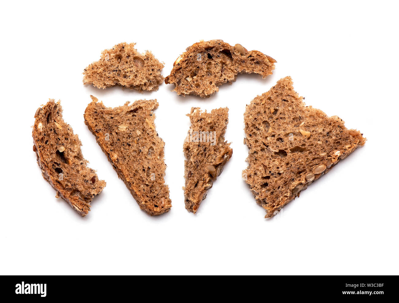 Top view of crumbled multi Grain brown Bread isolated on white Background Stock Photo