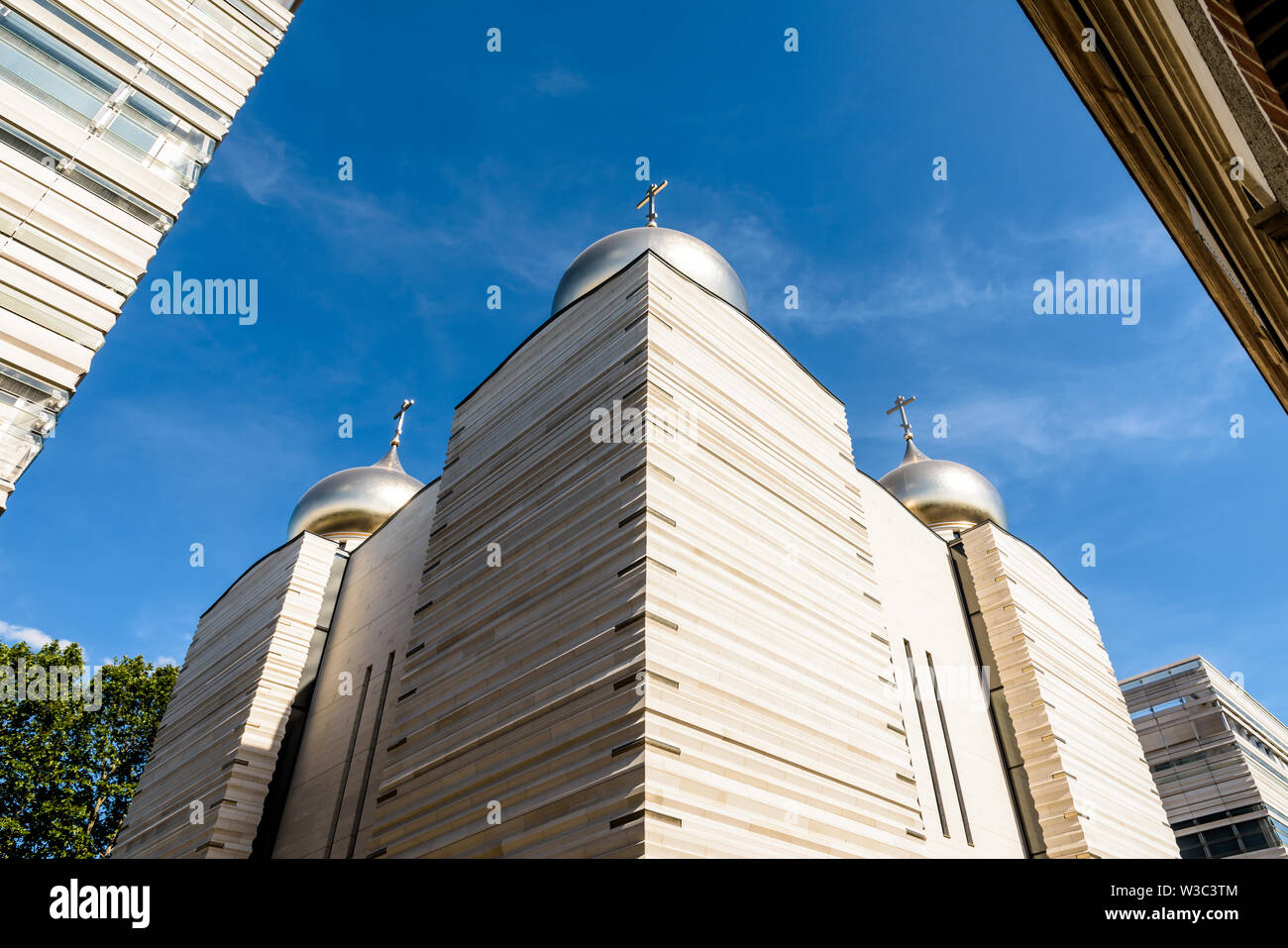 The Holy Trinity Cathedral is a modern Orthodox cathedral, topped by five golden onion domes with orthodox crosses, opened in 2016 in Paris, France. Stock Photo
