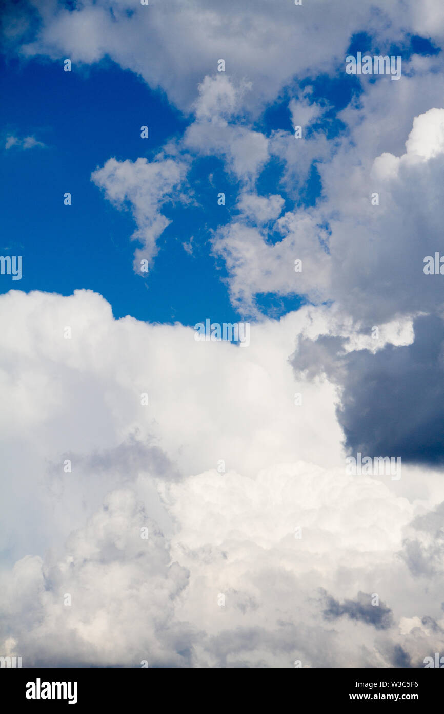 A landscape with blue sky and white cumulus clouds, background or ...