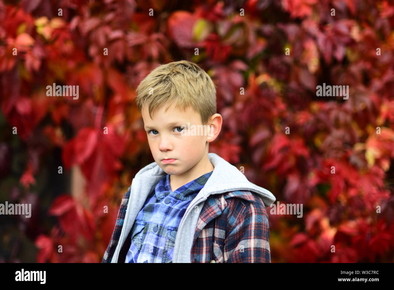 Sad and unhappy. Sad boy is blue in autumn. Small boy with sad look. Small child feel sad. Some days are just sad days, thats all Stock Photo