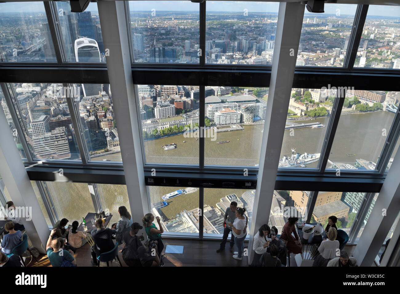 Public viewing gallery from the 72nd floor open observation deck of the Shard with windows to views of the Thames river London England Stock Photo