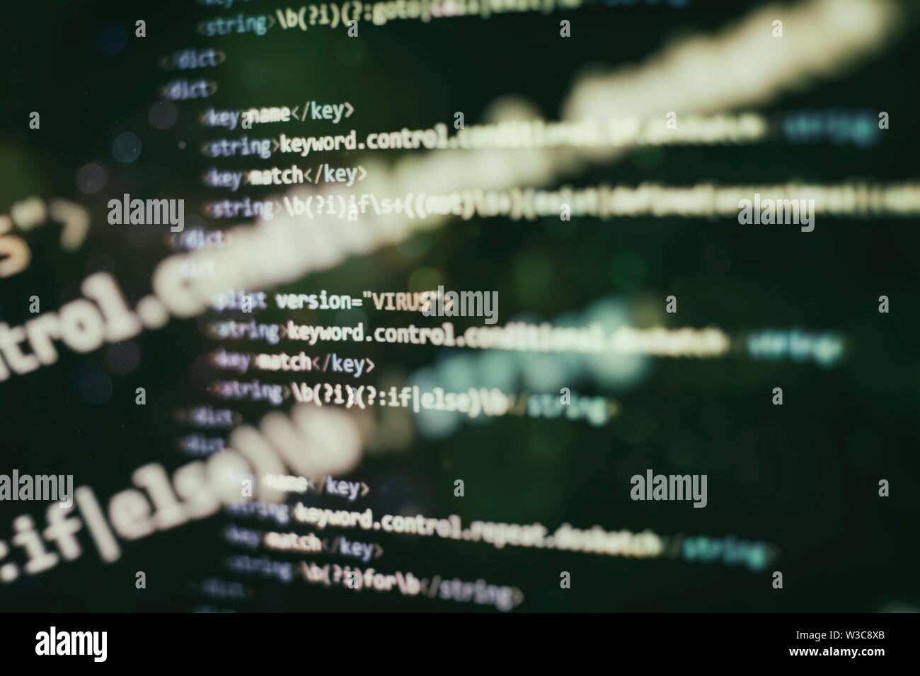 Website HTML Code on the Laptop Display Closeup Photo. Desktop PC monitor photo. Javascript functions, variables, objects. Stock Photo