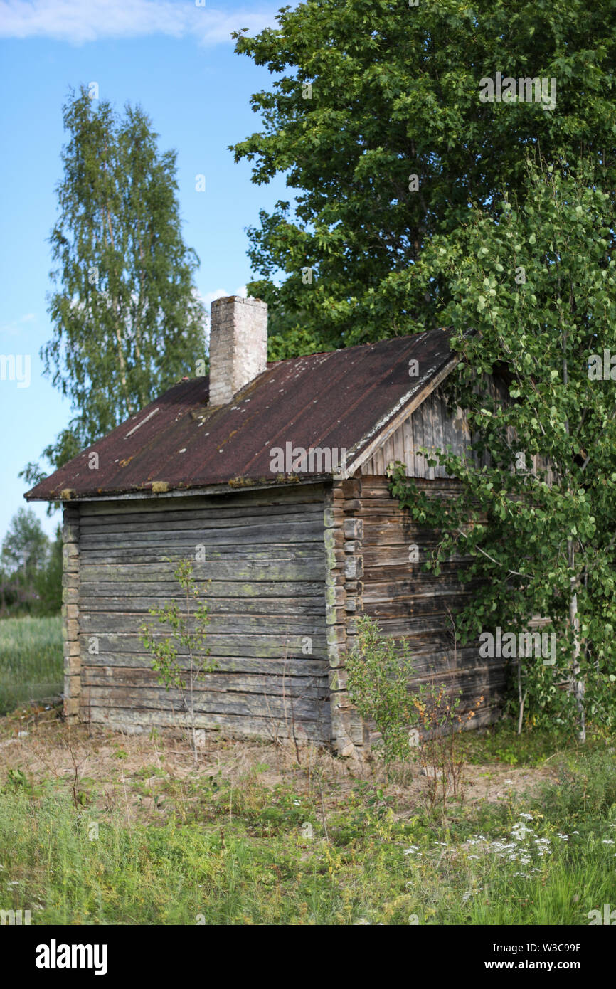 Old weathered log sauna at abandoned farmstead in Ylöjärvi, Finland Stock Photo