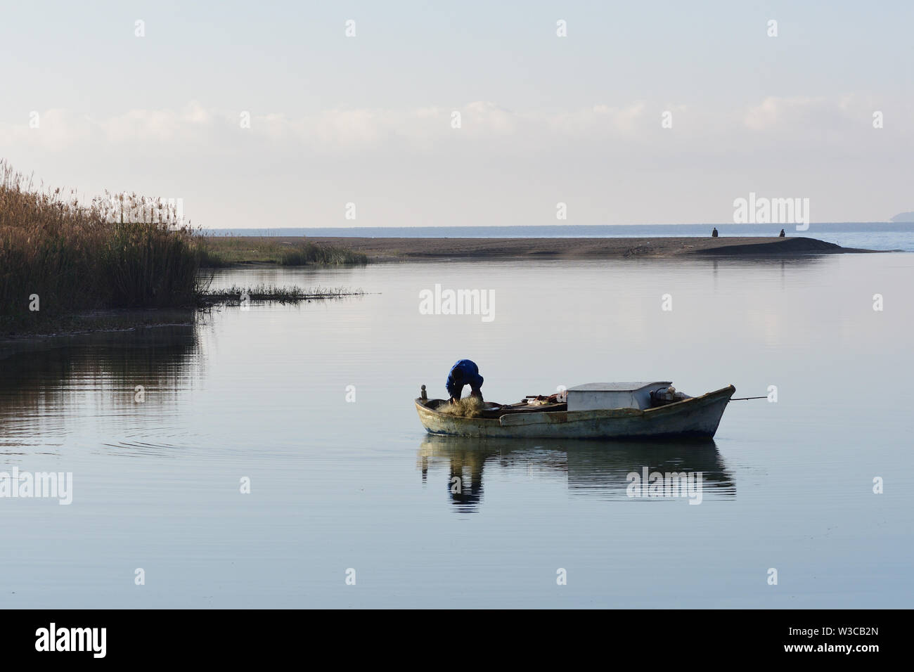man fishing coastal waters in Turkey Stock Photo