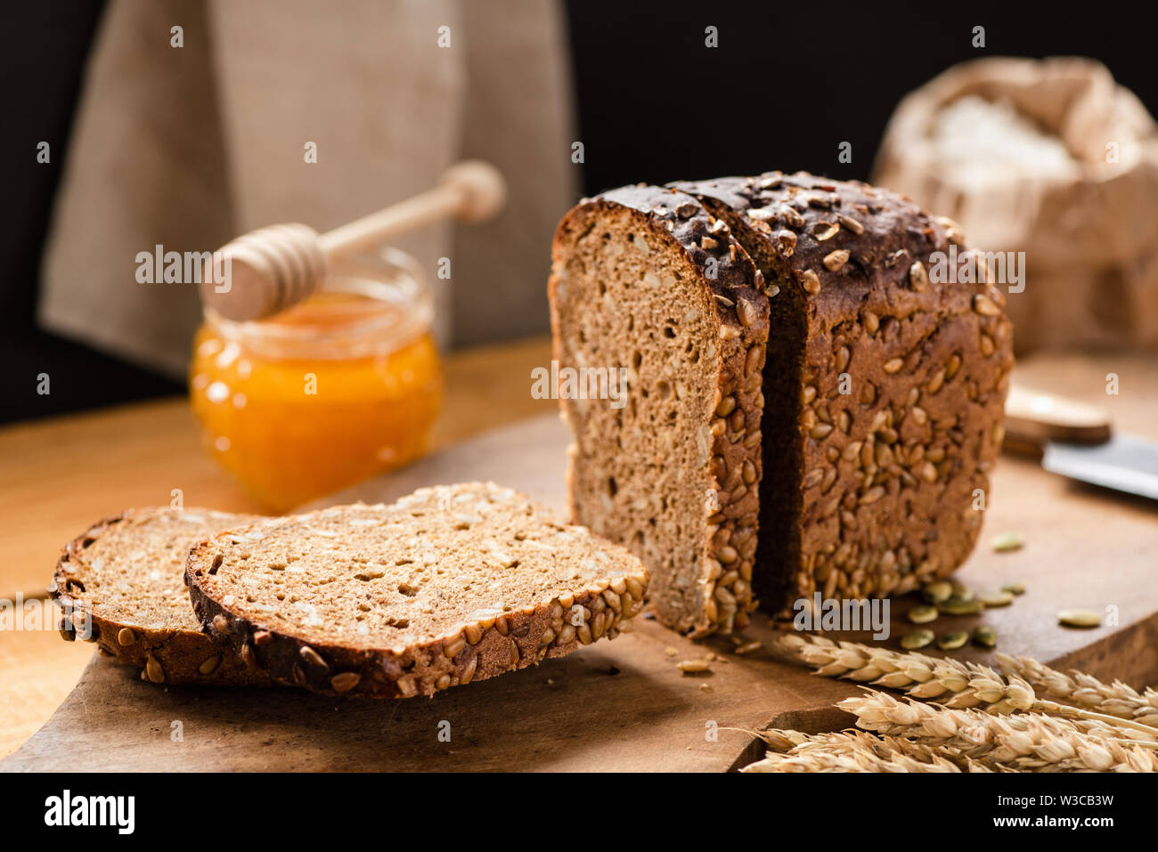 Loaf of rye bread with sunflower seeds in a bakery. Rustic still life
