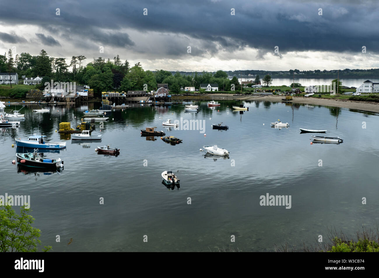 Lobster fishing boats moored in Mackerel Cove on Bailey Island on a stormy summers day in Harpswell, Maine. Stock Photo