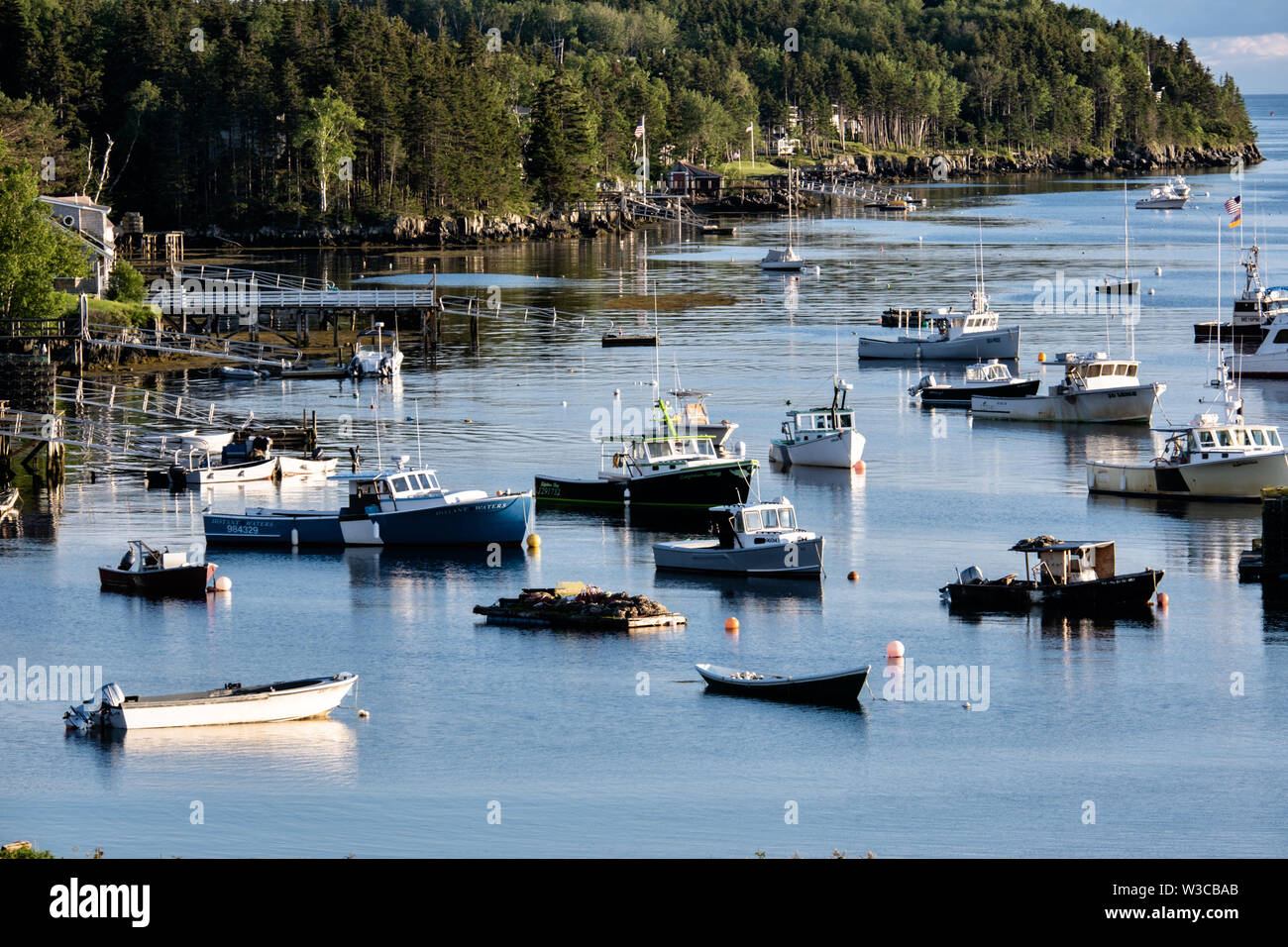 Lobster fishing boats moored in Mackerel Cove on Bailey Island on a summers day in Harpswell, Maine. Stock Photo