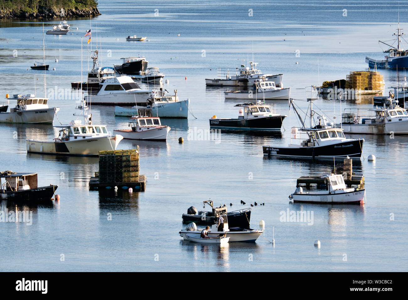 Lobster fishing boats moored in Mackerel Cove on Bailey Island on a summers day in Harpswell, Maine. Stock Photo