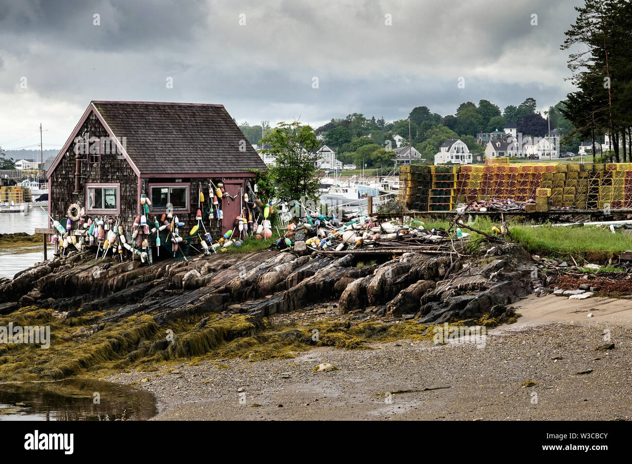 Historic Bailey Fish House covered in lobster buoys along Mackerel Cove