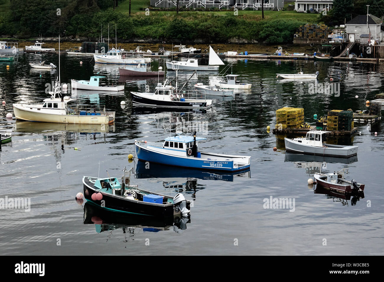 Lobster fishing boats moored in Mackerel Cove on Bailey Island on a summers day in Harpswell, Maine. Stock Photo