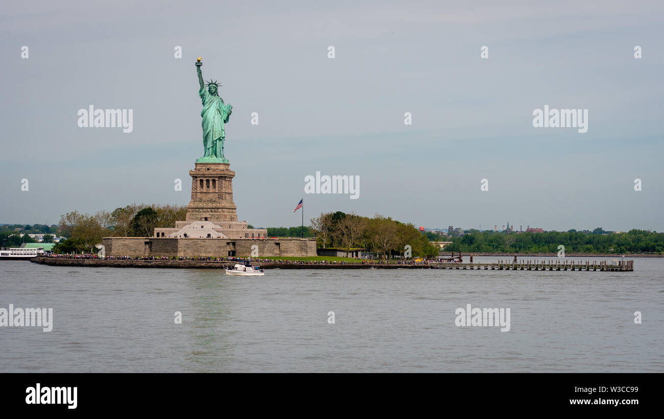 New York, USA June 7, 2019 Ferry Boat approaching the Statue of