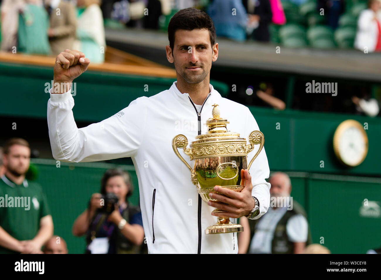 London, UK, 14th July 2019: Novak Djokovic from Serbia holds the trophy after his 2019 Wimbledon victory at the All England Lawn Tennis and Croquet Club in London. Credit: Frank Molter/Alamy Live news Stock Photo