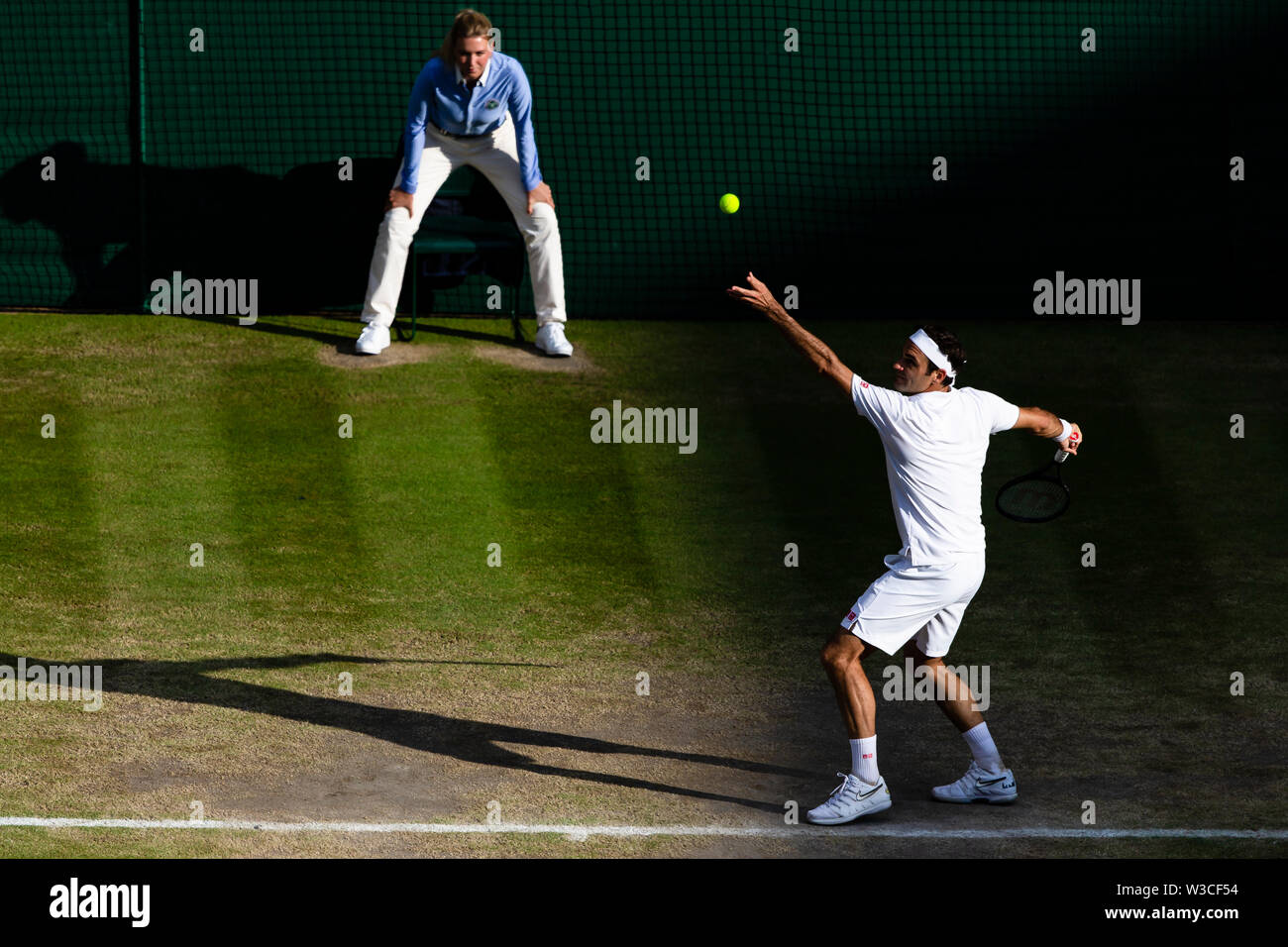 London, UK, 14th July 2019: Roger Federer from Switzerland is in action during the 2019 Wimbledon Men's Final at the All England Lawn Tennis and Croquet Club in London. Credit: Frank Molter/Alamy Live news Stock Photo