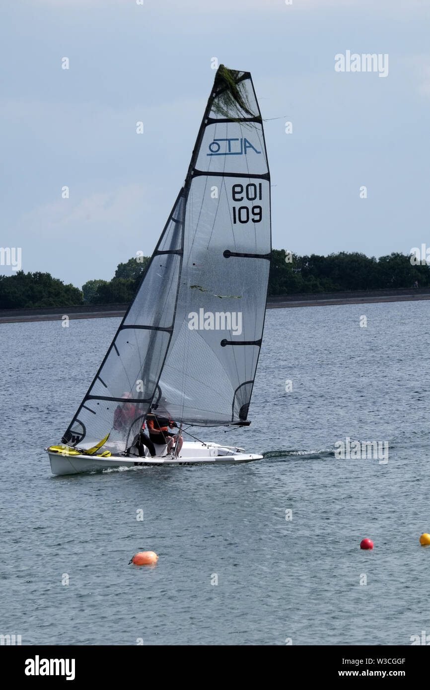 July 2019 - Sailing fast on Cheddar Reservoir, Sunday afternoon. Stock Photo