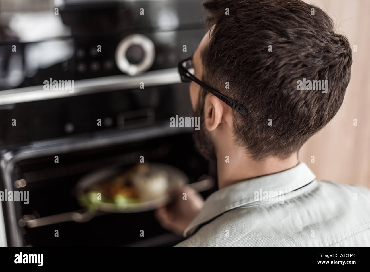 friendly man inviting to Breakfast in his kitchen Stock Photo