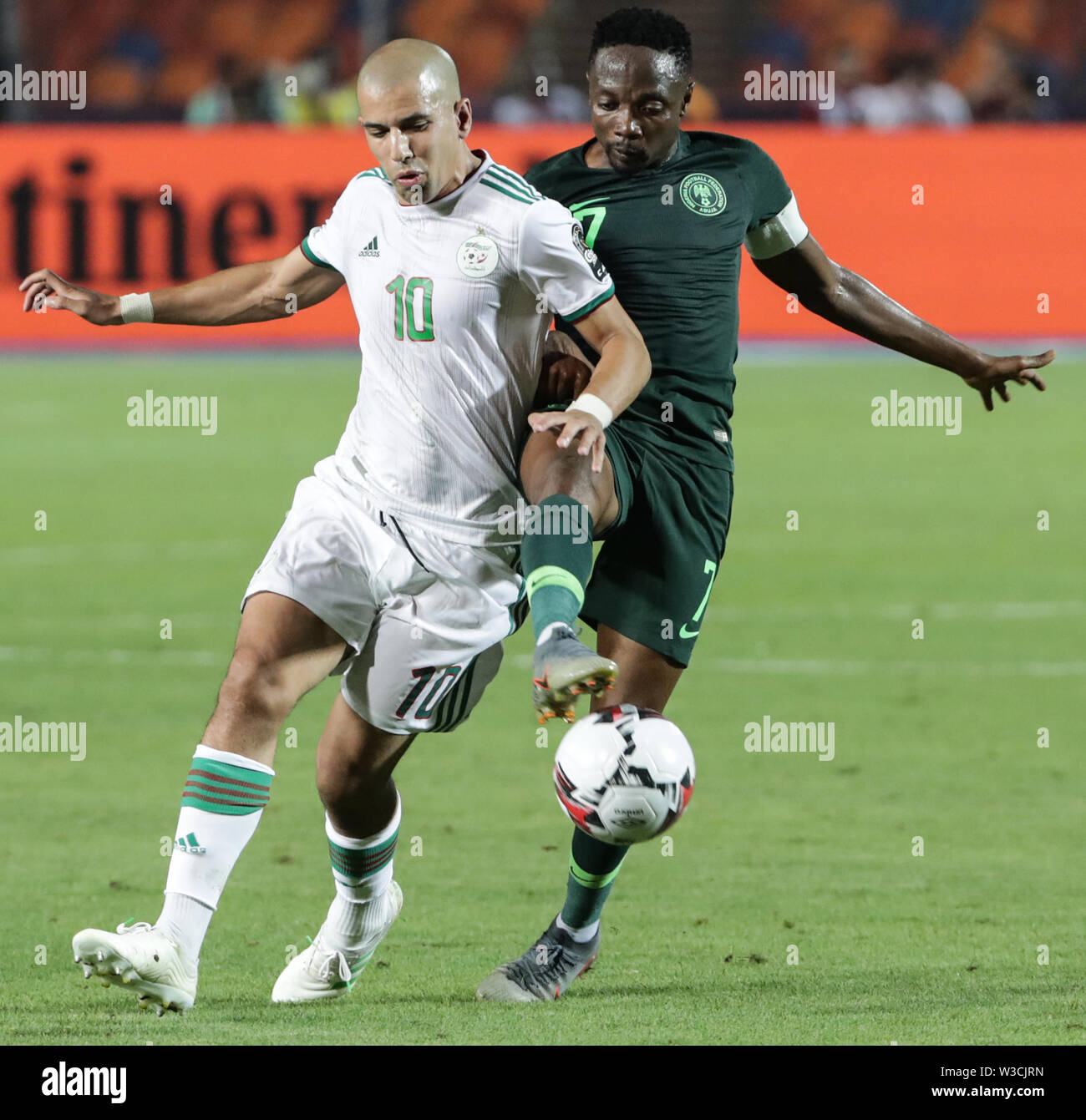 Cairo, Egypt. 14th July, 2019. Algeria's Sofiane Feghouli (L) and Nigeria's Ahmed Musa during the 2019 Africa Cup of Nations semi-final soccer match between Algeria and Nigeria at the Cairo International Stadium. Credit: Oliver Weiken/dpa/Alamy Live News Stock Photo