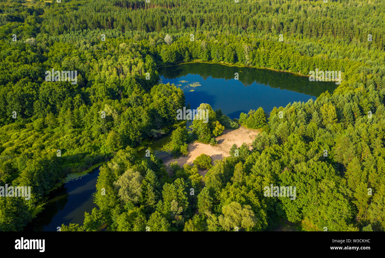 Top view of the lake located in the middle of the forest Stock Photo ...