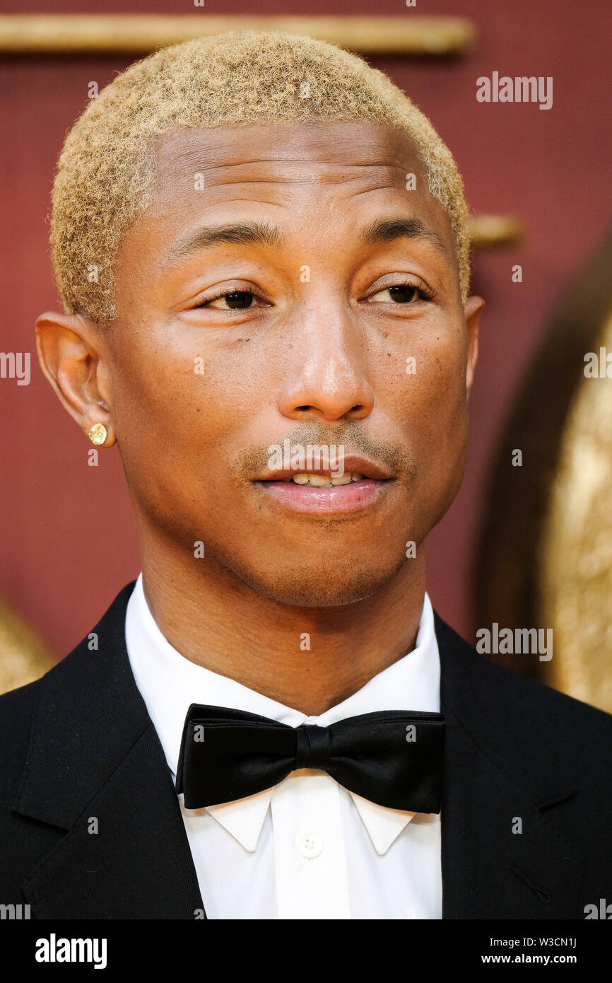 London, UK. 14th July 2019. Pharrell Williams poses on the yellow carpet at the European premiere of Disneys 'The Lion King' on Sunday 14 July 2019 at ODEON LUXE Leicester Square, London. Pharrell Williams. Picture by Julie Edwards. Credit: Julie Edwards/Alamy Live News Stock Photo
