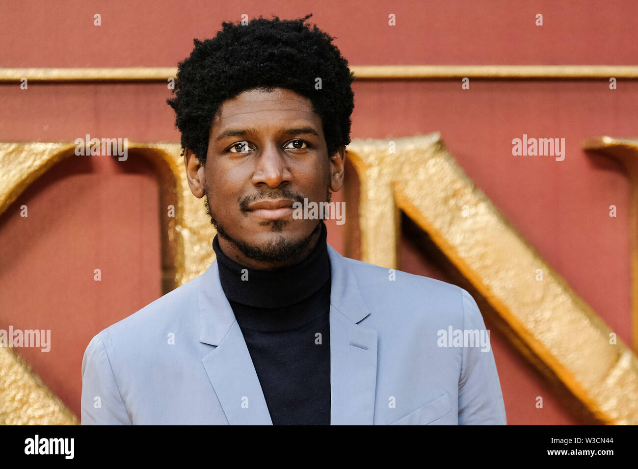 London, UK. 14th July 2019. Labrinth poses on the yellow carpet at the European premiere of Disneys 'The Lion King' on Sunday 14 July 2019 at ODEON LUXE Leicester Square, London. Labrinth, Timothy Lee McKenzie. Picture by Julie Edwards. Credit: Julie Edwards/Alamy Live News Stock Photo