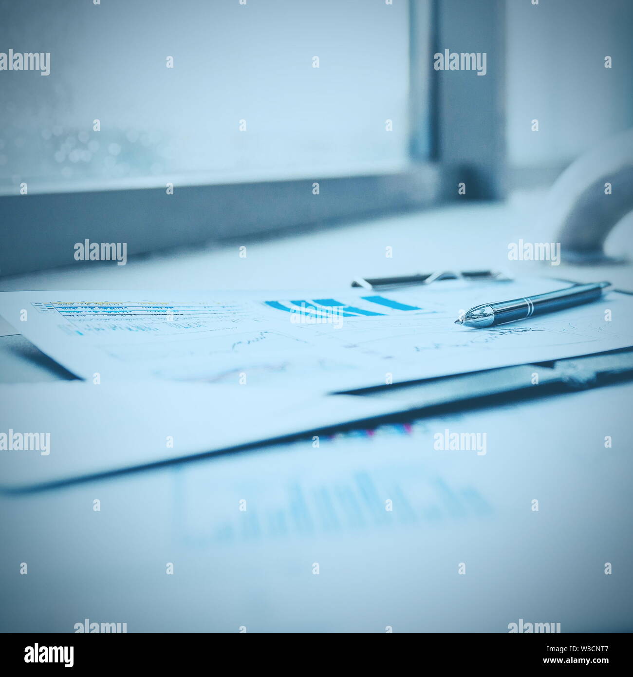 pen and financial documents on the desktop in the office. business