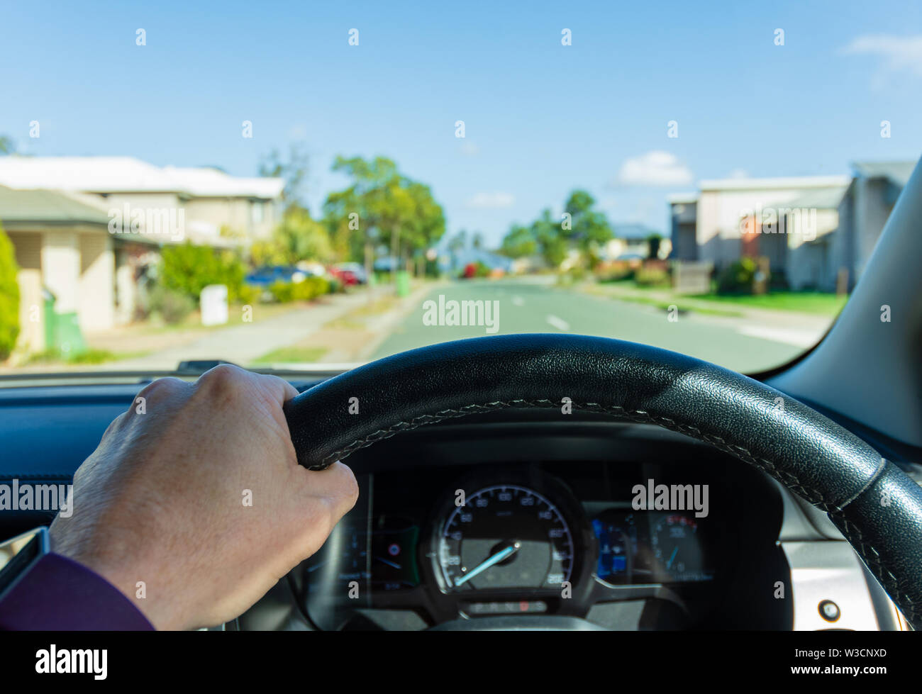 A Driver's view of Driving a car through the Suburbs of Australia Stock Photo