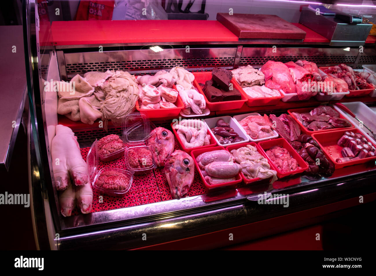 A horrific butcher's display showing sheep's feet, brains, heads, testicles, stomach and liver perfect for Halloween Stock Photo