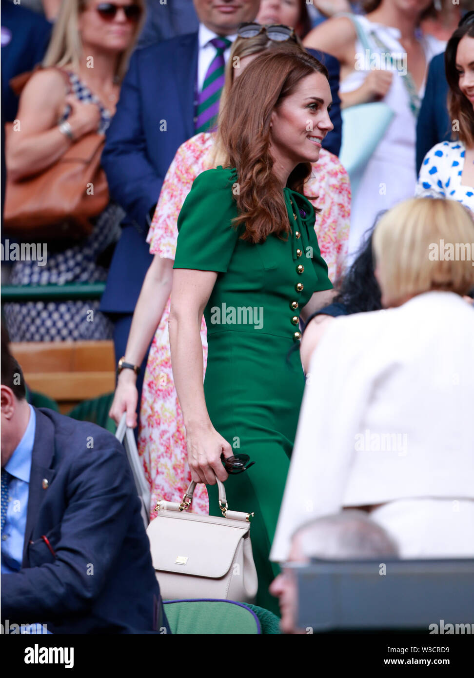 Wimbledon, London, UK. 13th July 2019. Kate Middleton (Duchess of  Cambridge) and Meghan Markle (Duchess of Sussex) watch the Ladies Singles  Final between Serena Williams and Simona Halep at The Wimbledon  Championships