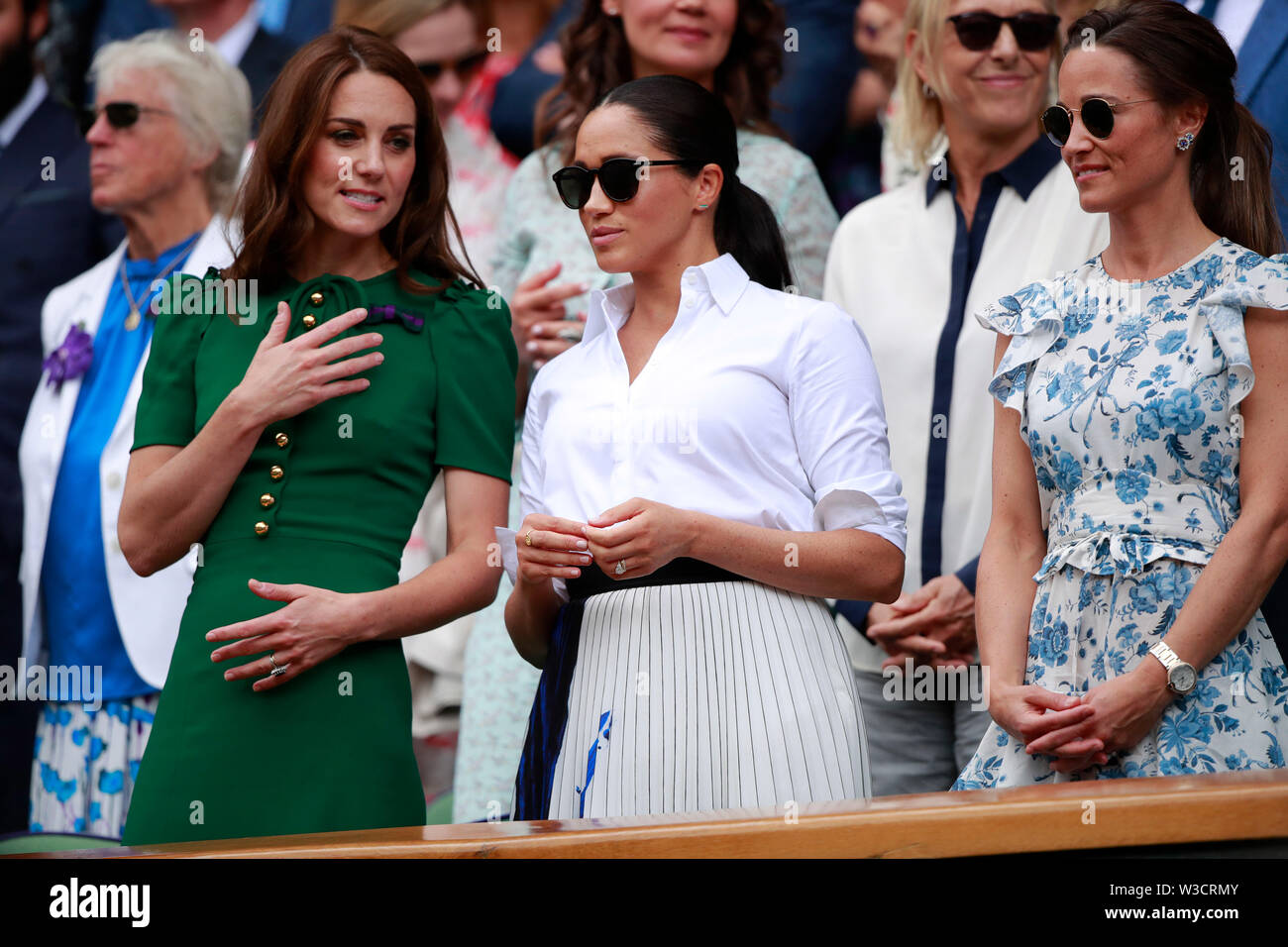Wimbledon, London, UK. 13th July 2019. Kate Middleton (Duchess of  Cambridge) and Meghan Markle (Duchess of Sussex), Pippa Middleton watch the  Ladies Singles Final between Serena Williams and Simona Halep at The
