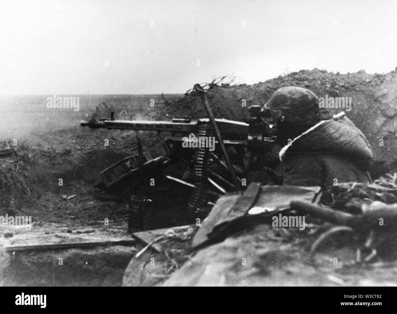 German Soldier firing an MG42 on the Eastern Front 1944 Stock Photo