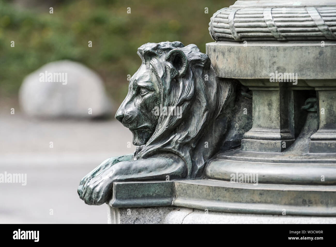 Fragment of a bronze lion sculptures at the base of the monument Stock Photo