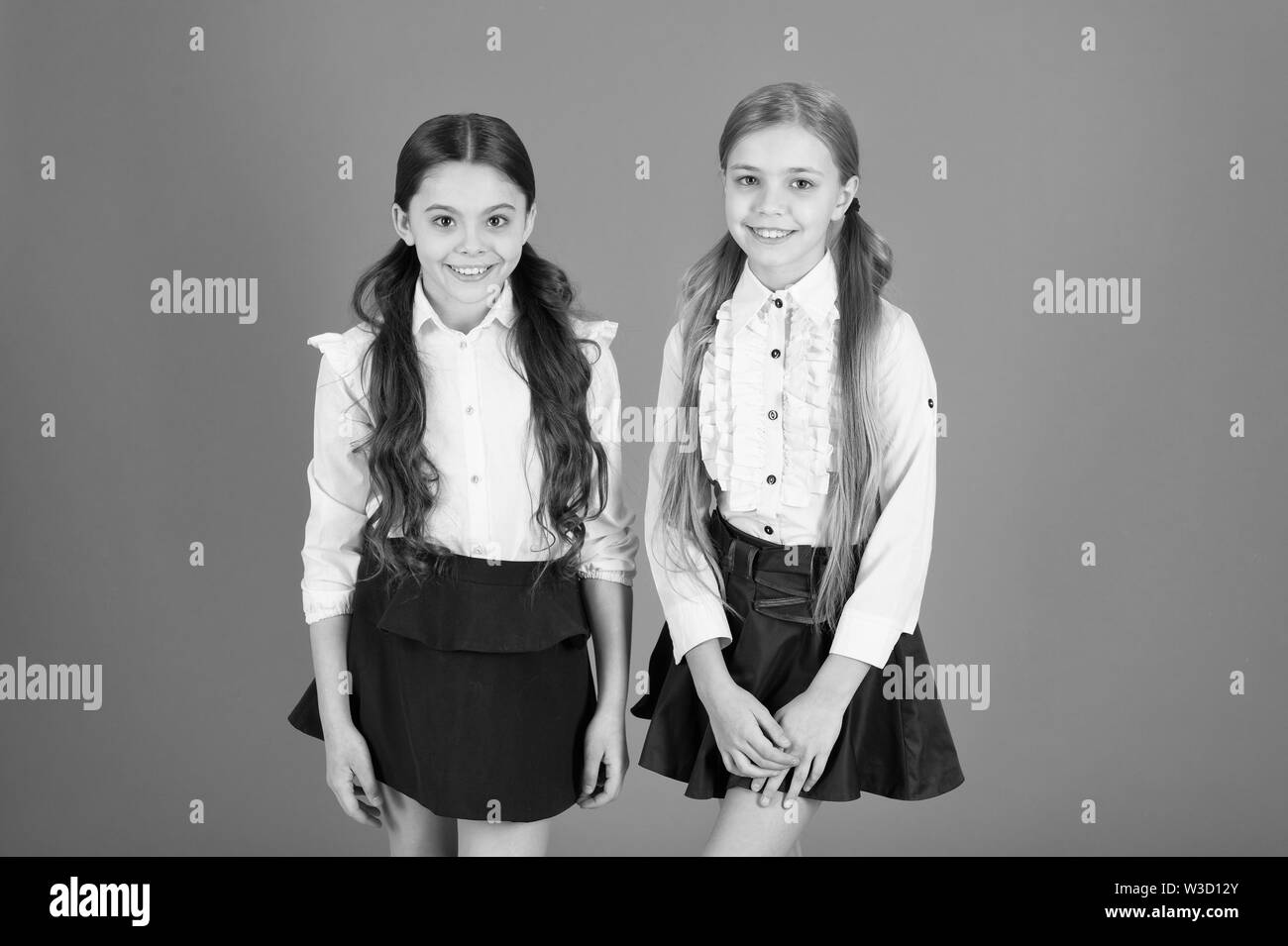 Girl with make up in school uniform Black and White Stock Photos