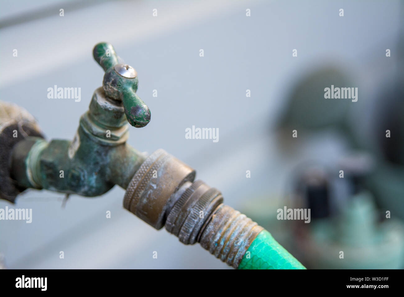 old garden hose spigot valve Stock Photo Alamy