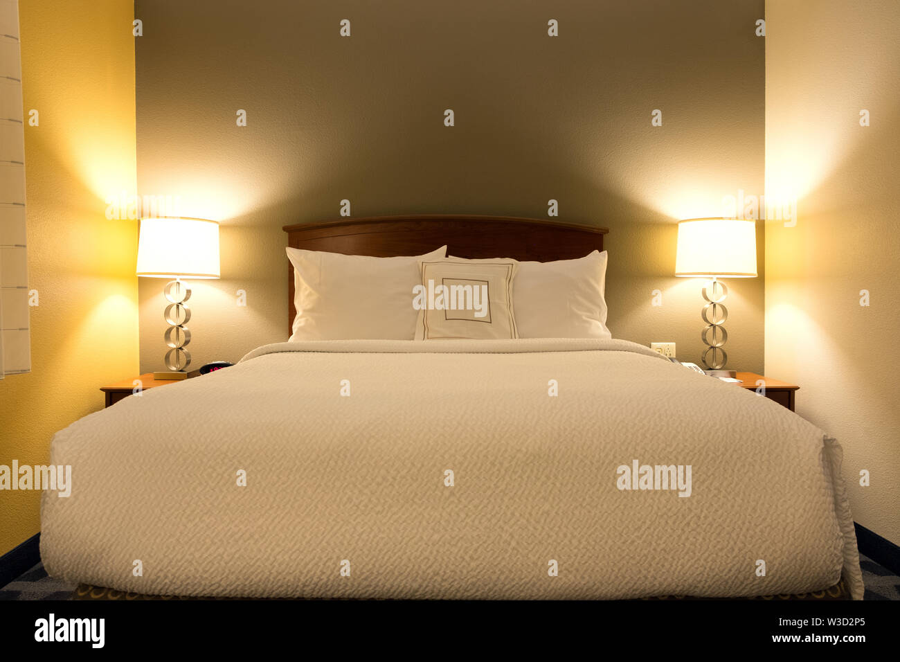 King sized bed in a luxury hotel room Stock Photo