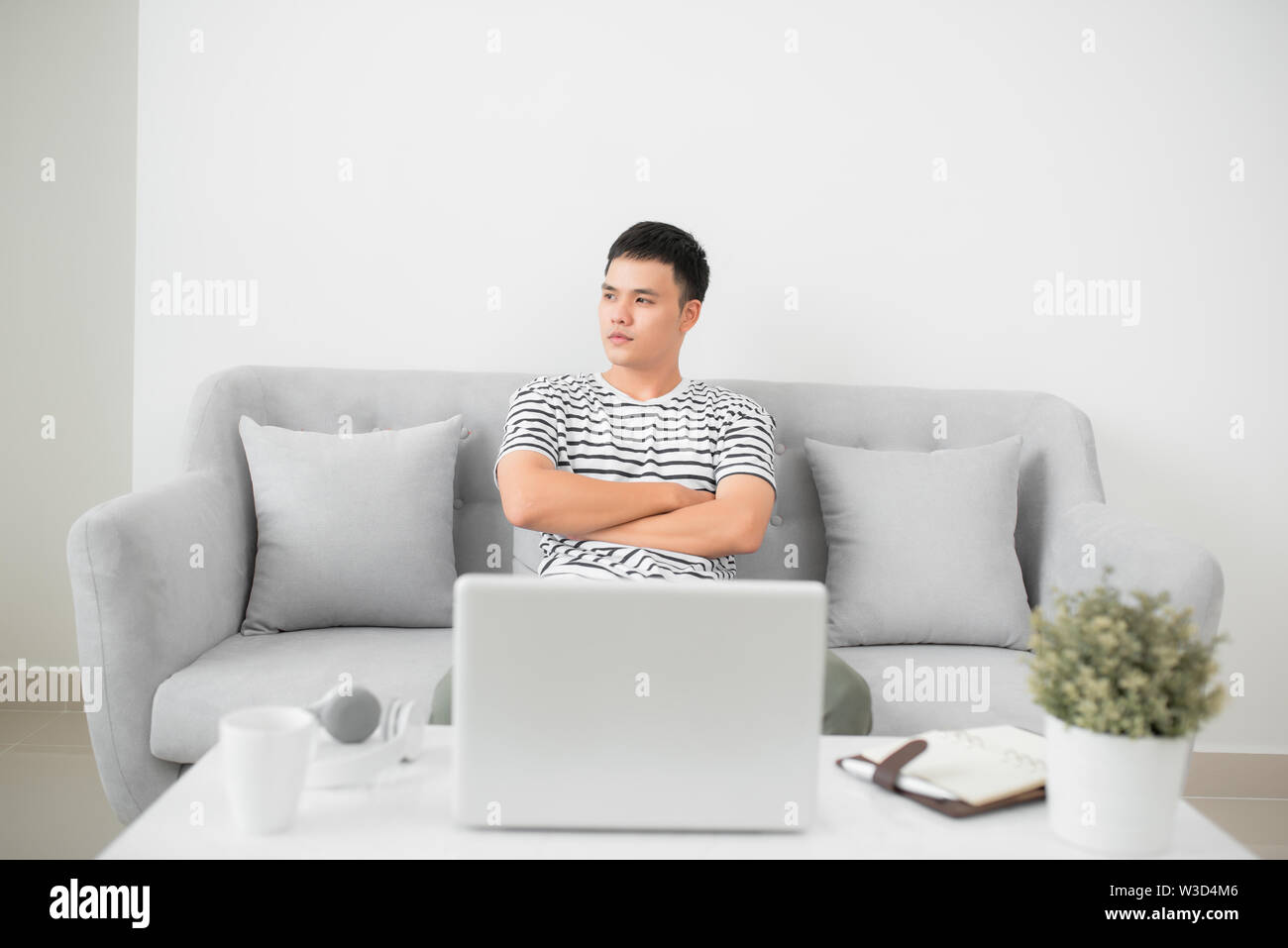 Thoughtful pensive handsome serious male thinking about new idea or project analysing planning making decision concept Stock Photo