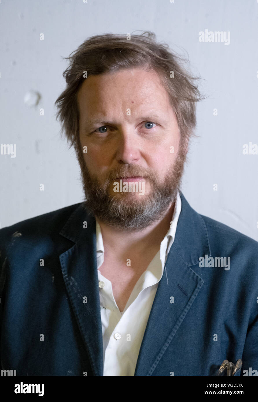 Stuttgart, Germany. 12th July, 2019. Ragnar Kjartansson, performance artist from Iceland, photographed in the rooms of the Kunstmuseum before the beginning of his exhibition with the title: 'Scheize - Liebe - Sehnsucht'. Credit: Bernd Weißbrod/dpa/Alamy Live News Stock Photo