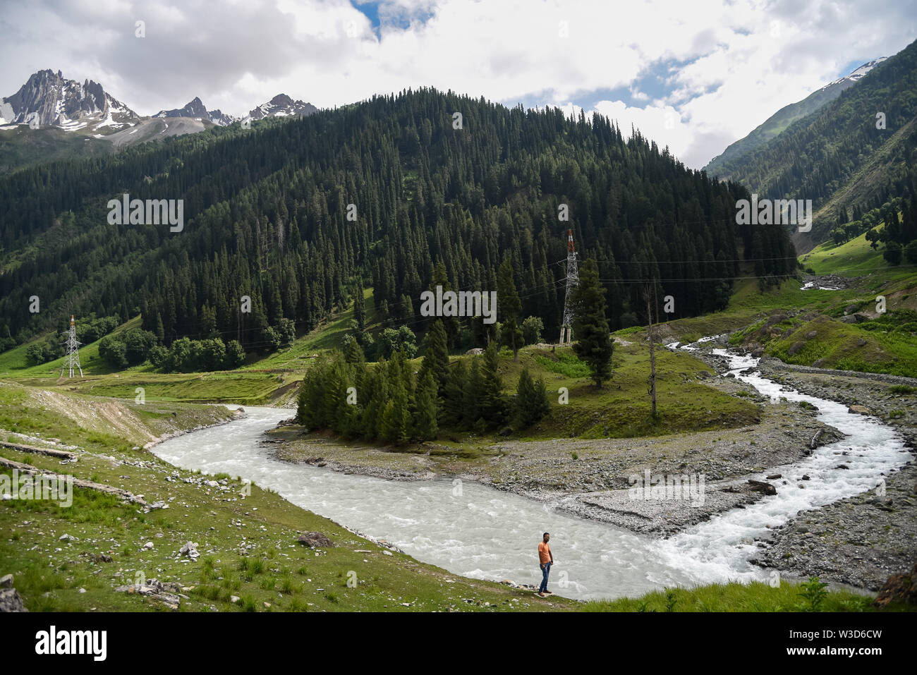 Ganderbal, India. 13th July, 2019. River Sindh flowers under the foothill of Himalayan mountains during a cloudy evening in Sonamarg, some 85kms from summer capital Srinagar.Jammu and Kashmir is a disputed territory divided between India and Pakistan but claimed in its entirety by both sides. Credit: SOPA Images Limited/Alamy Live News Stock Photo