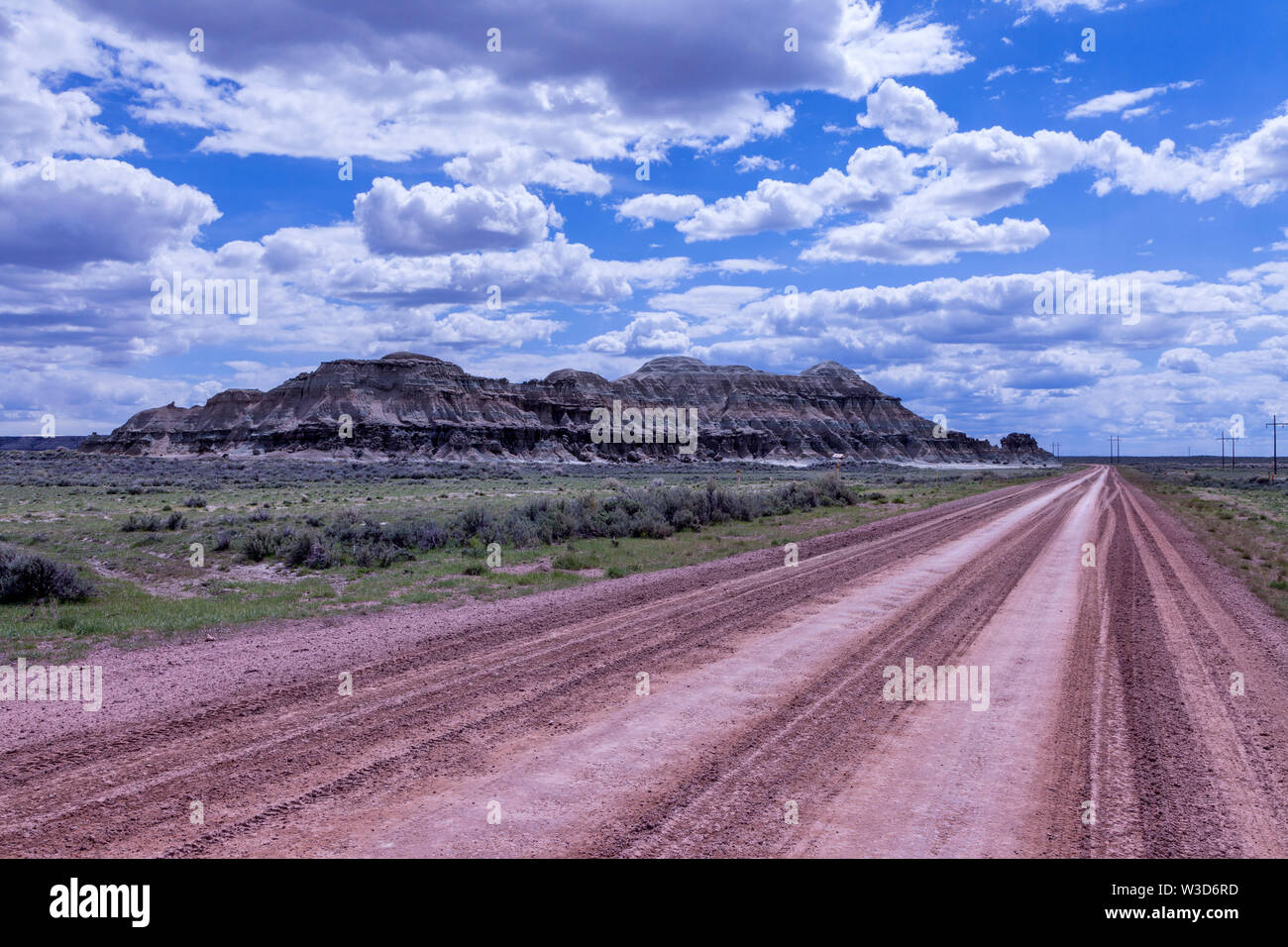 Church Buttes and the Lincoln Highway heading west between Granger and Lyman. Stock Photo