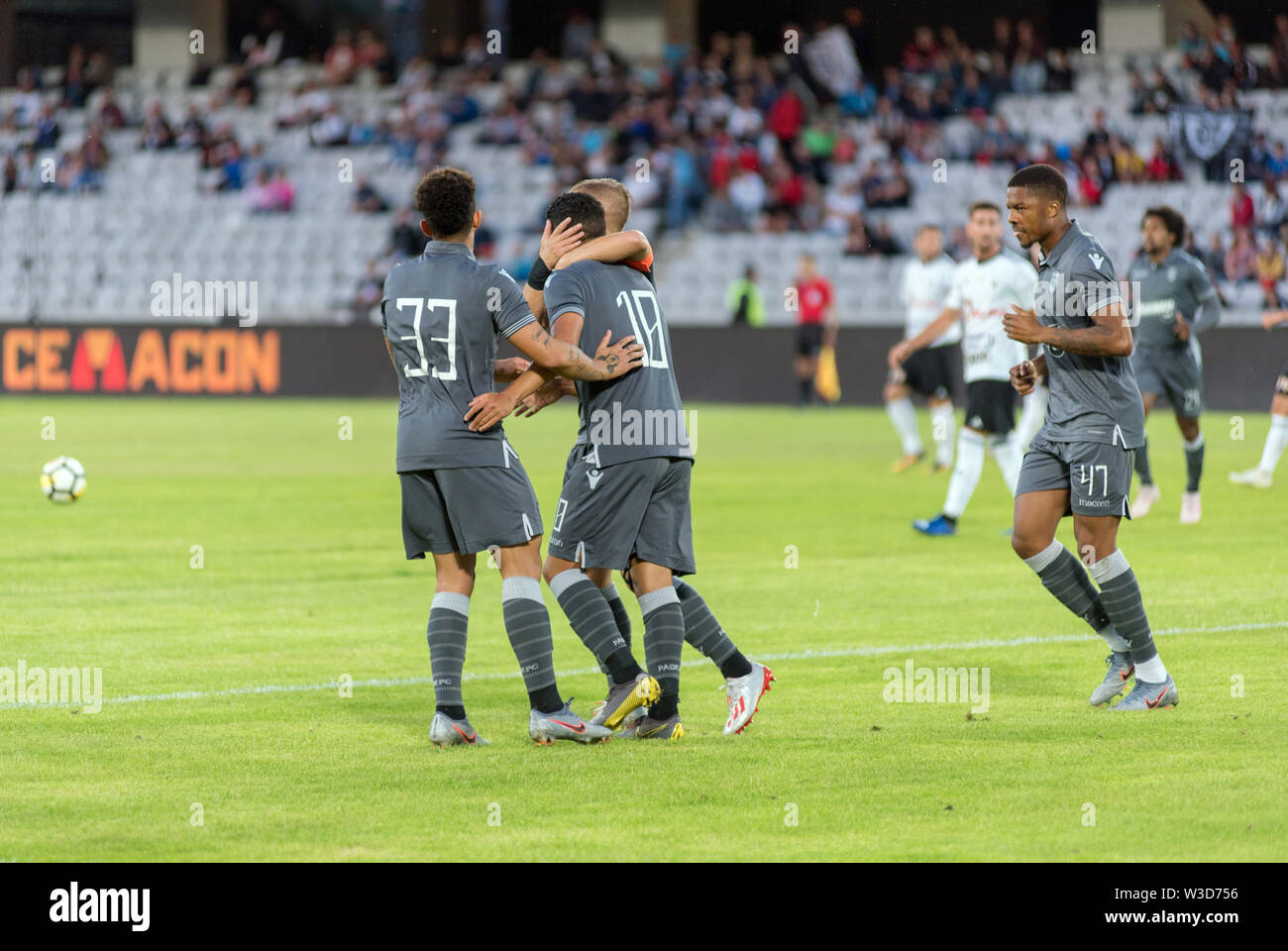 CLUJ NAPOCA, ROMANIA - JULY 12, 2019: Soccer players of FC PAOK Saloniki celebrating the goal of Douglas Augusto during a football match against Unive Stock Photo