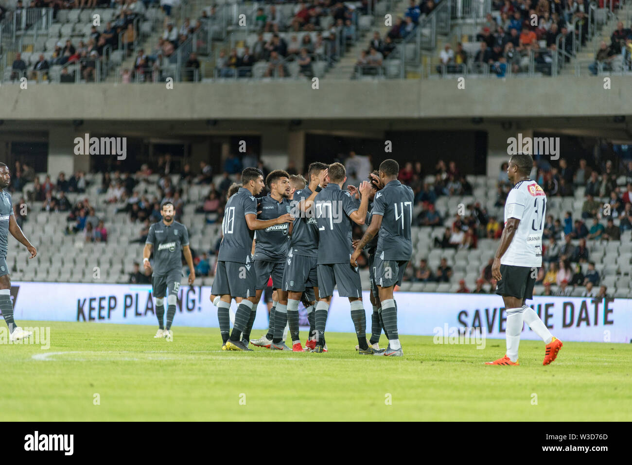 CLUJ NAPOCA, ROMANIA - JULY 12, 2019: Soccer players of FC PAOK Saloniki celebrating the goal of Douglas Augusto during a football match against Unive Stock Photo