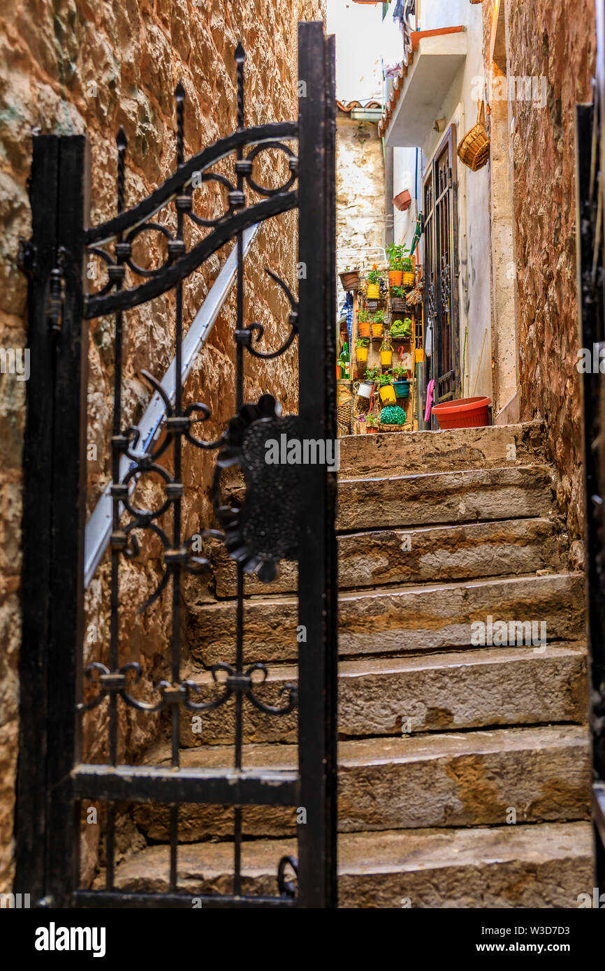 Wrought iron gate in the narrow streets of the medieval Old town with