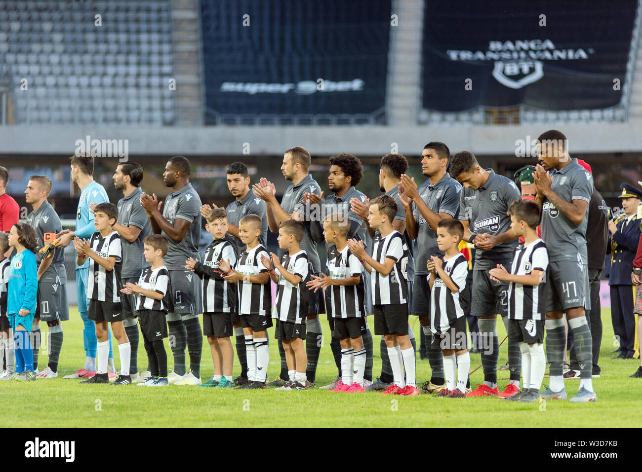 CLUJ NAPOCA, ROMANIA - JULY 12, 2019: Soccer players of PAOK Saloniki entering the field at the beginning of a friendly football match against Univers Stock Photo