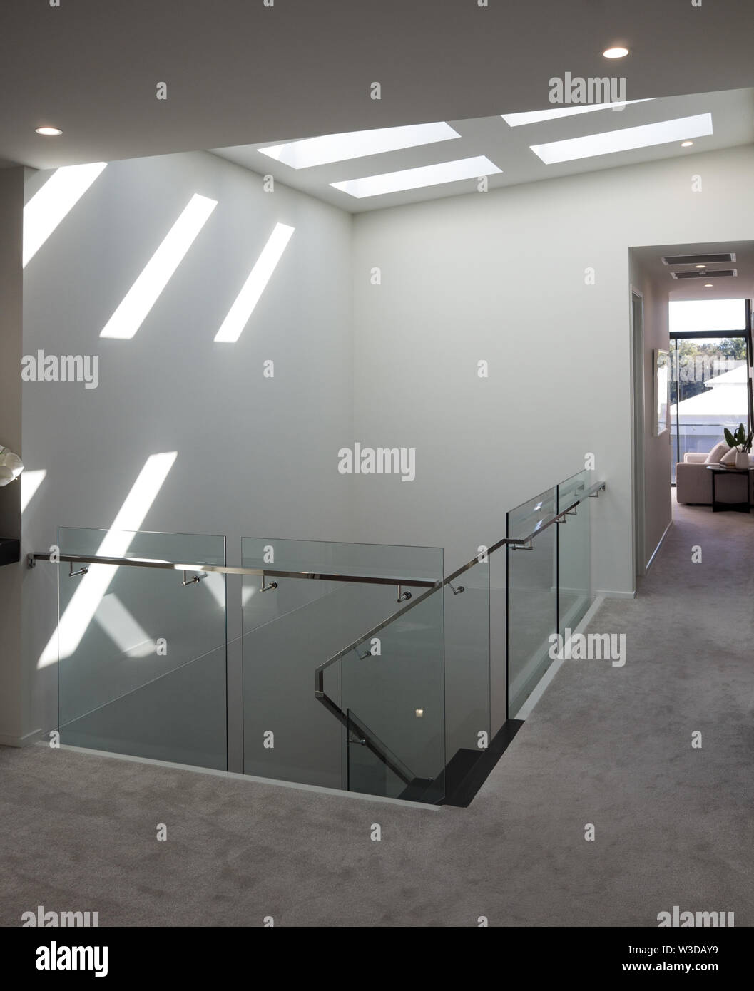 Window Through Ceiling Modern staircase with bright sunlight through ceiling windows Stock ...