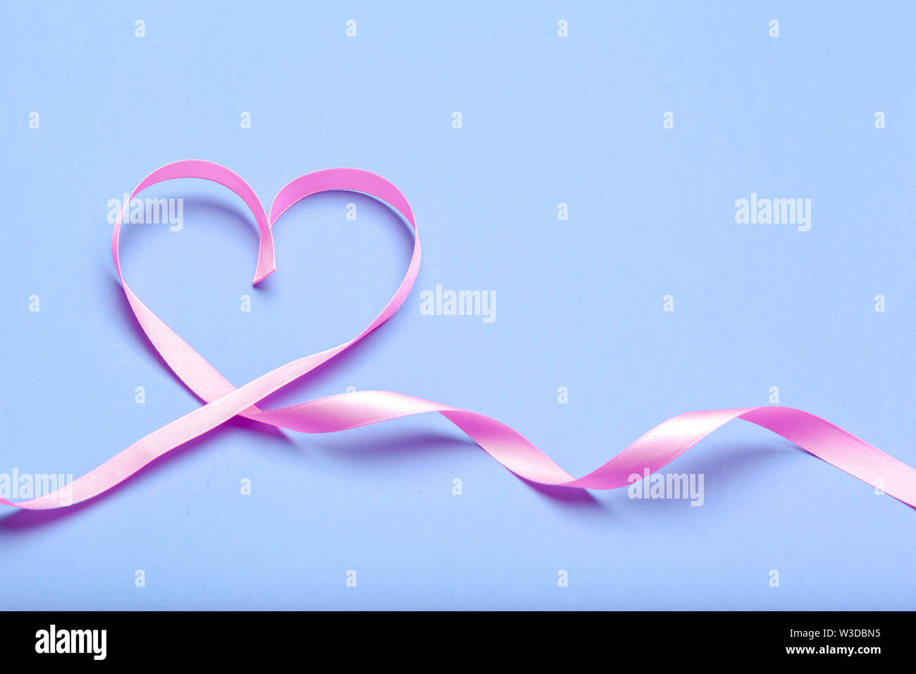 ribbon HIV, AIDS on blue background Stock Photo - Alamy