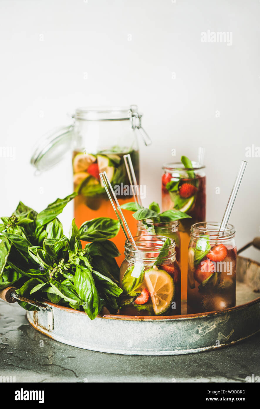 Fresh strawberry and basil lemonade or iced-tea in glasses Stock Photo