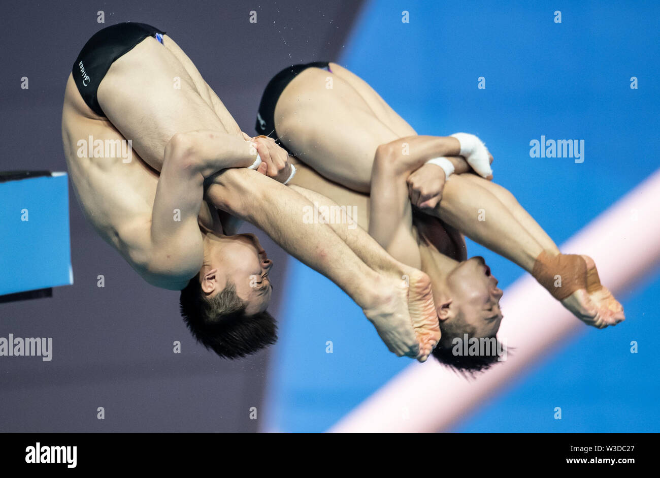 Gwangju. 15th July, 2019. Cao Yuan/Chen Aisen (front) of China compete  during the men's 10m synchro platform final of diving event at FINA World  Championships in Gwangju, South Korea on July 15,